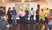 guests at the tao gallery exhibition of paintings by christina pierce, cricket artist